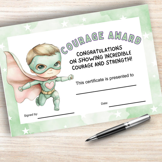 a Printable Courage Certificate for Kids on a wood background with a pen